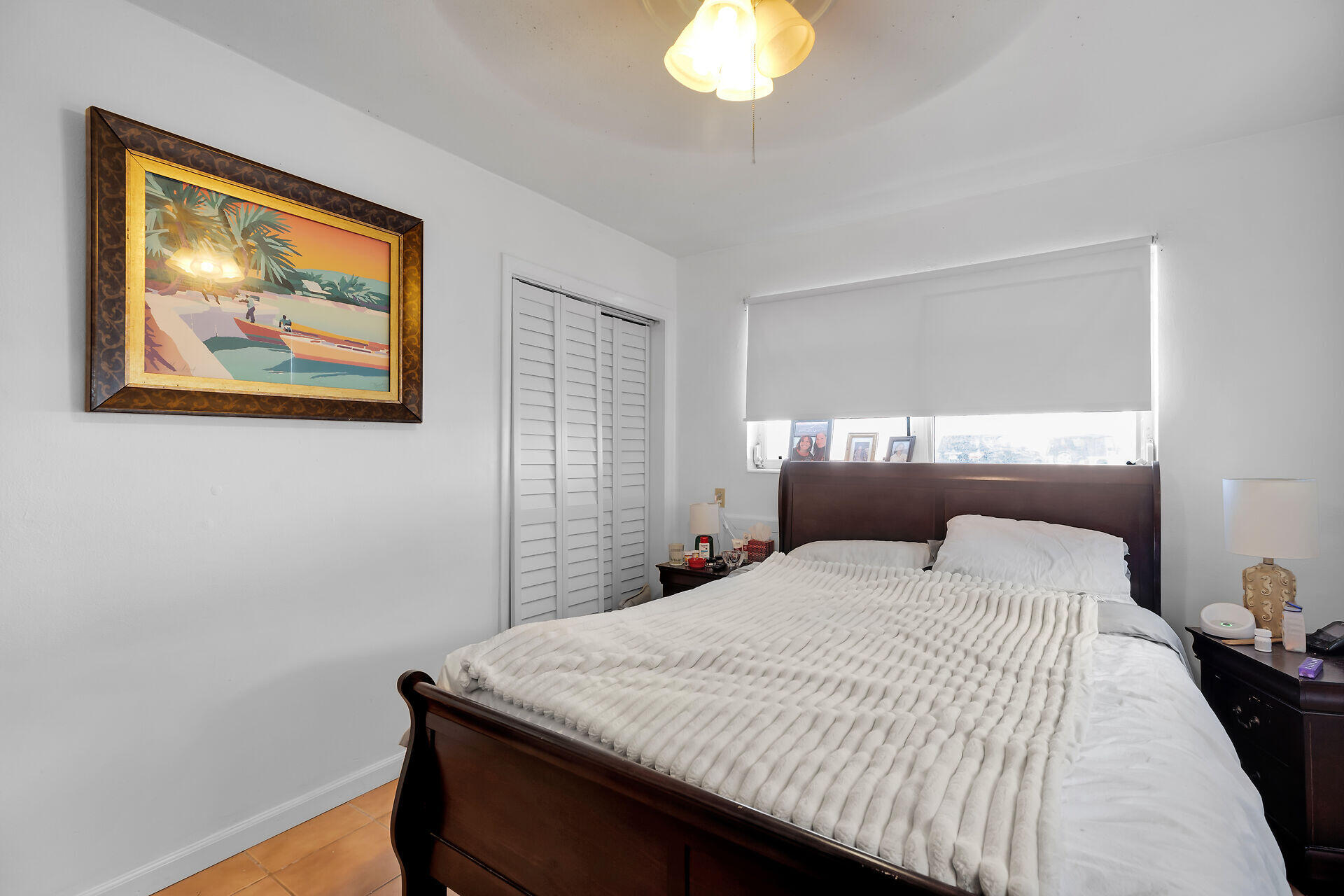 1614 Dennis Street Key West, FL 33040 - Photo 40 of 59 a bedroom with a bed and a painting on the wall