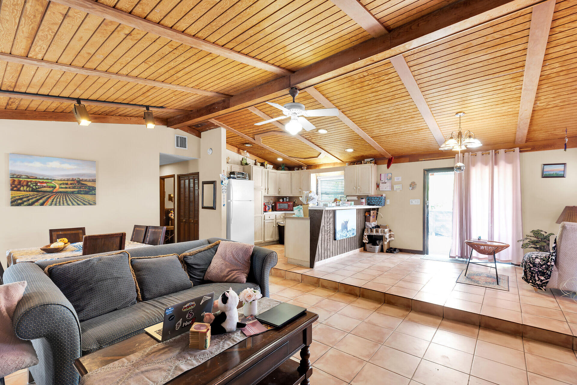 1614 Dennis Street Key West, FL 33040 - Photo 46 of 59 a living room with furniture and a chandelier