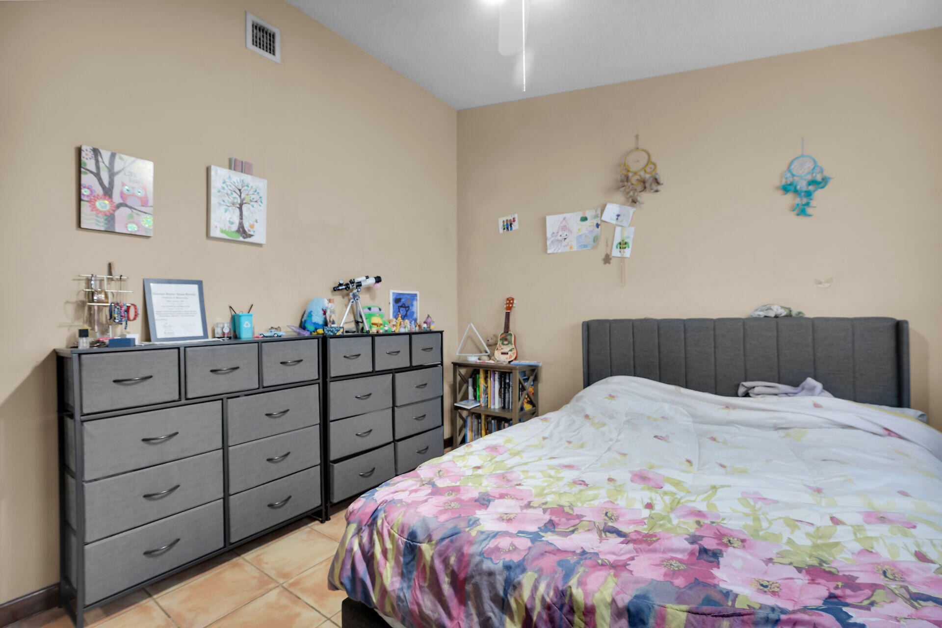 1614 Dennis Street Key West, FL 33040 - Photo 56 of 59 a bedroom with a bed and a dresser in it