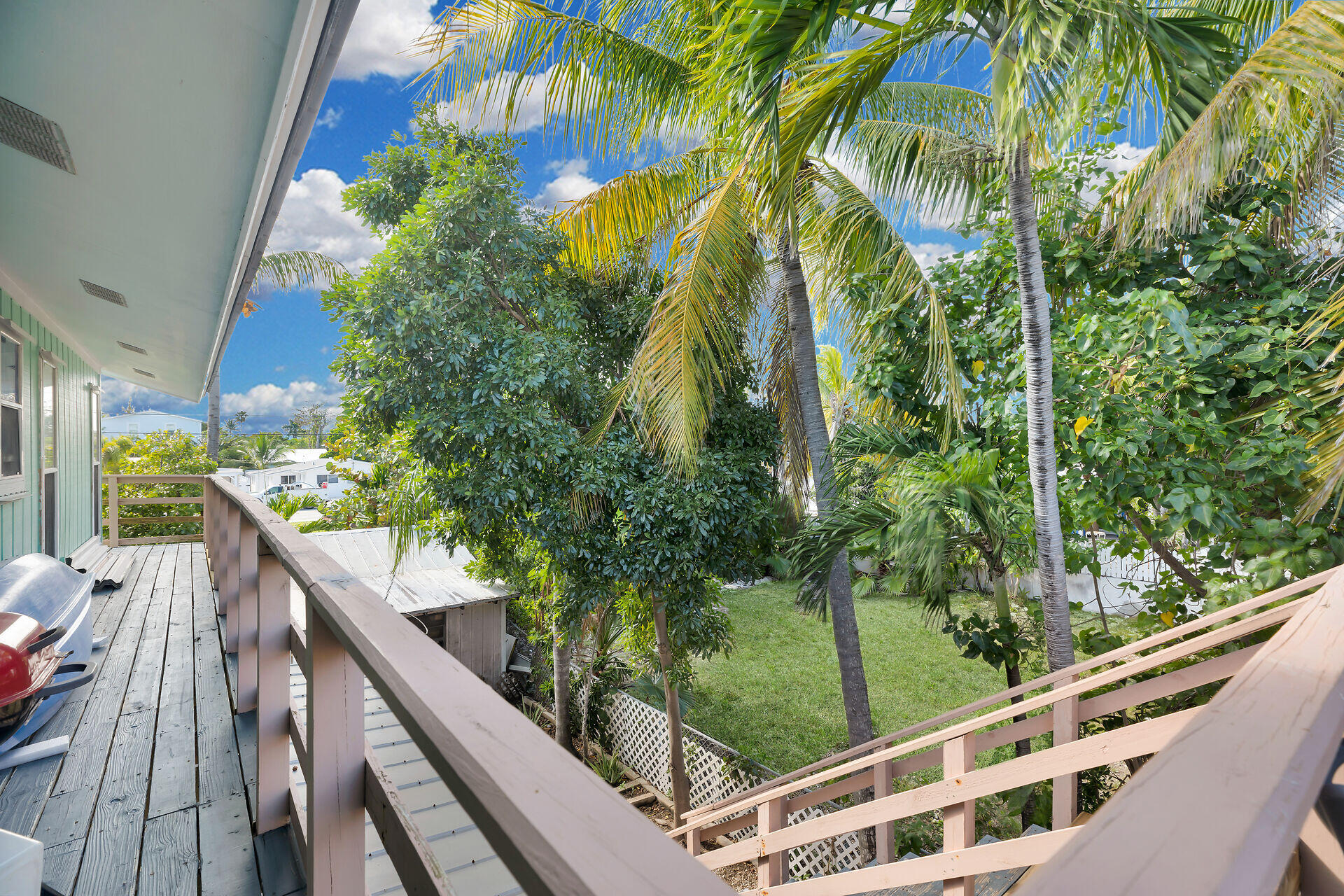 1614 Dennis Street Key West, FL 33040 - Photo 59 of 59 a view of balcony with wooden floor and fence