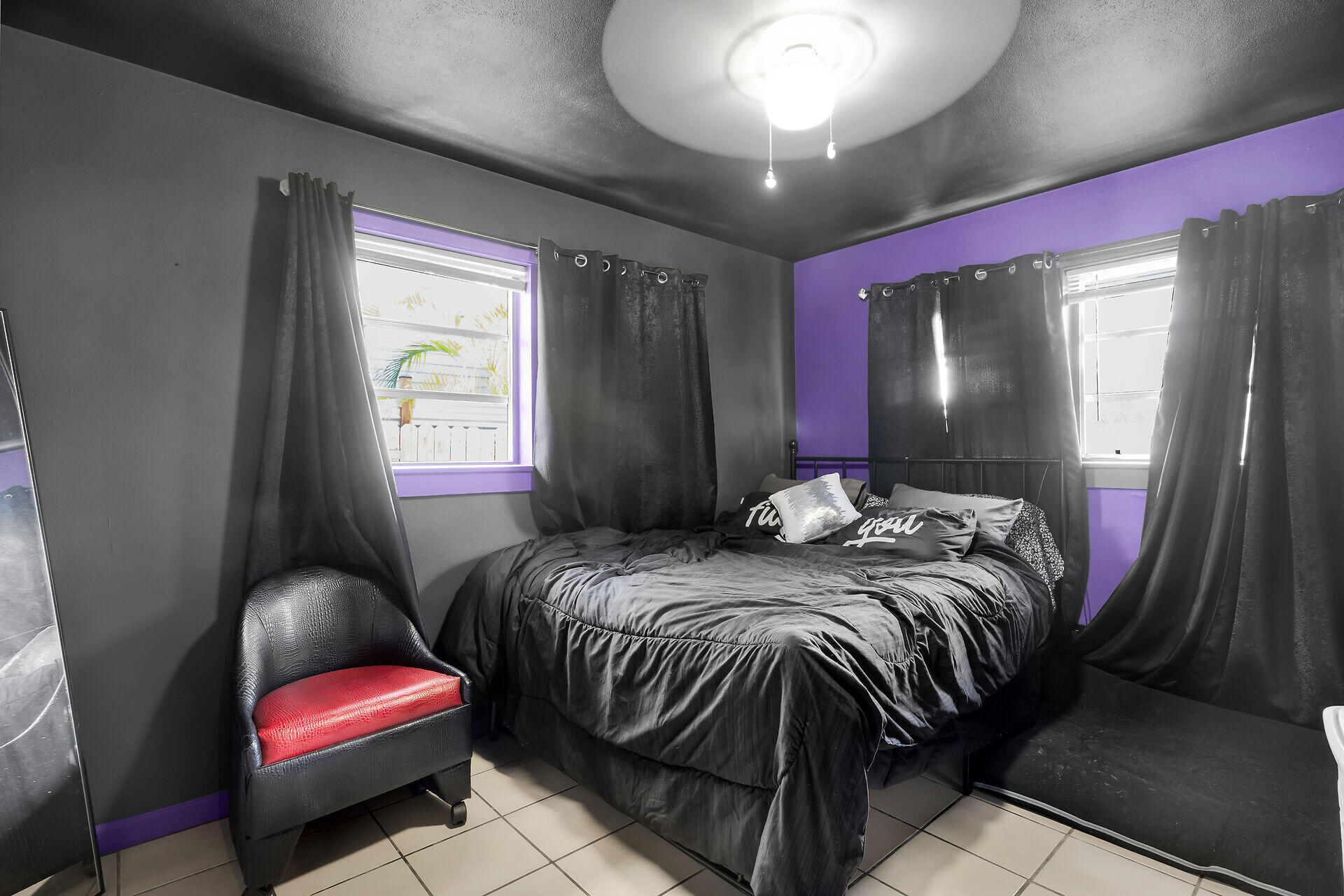 1614 Dennis Street Key West, FL 33040 - Photo 6 of 59 a bedroom with bed and a large mirror