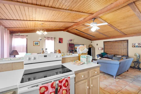 a living room with furniture and flat screen tv