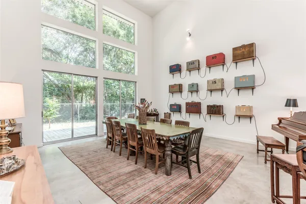 a living room with furniture or kitchen view and a wooden floor