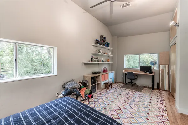 a kitchen with a stove a refrigerator and a dining table