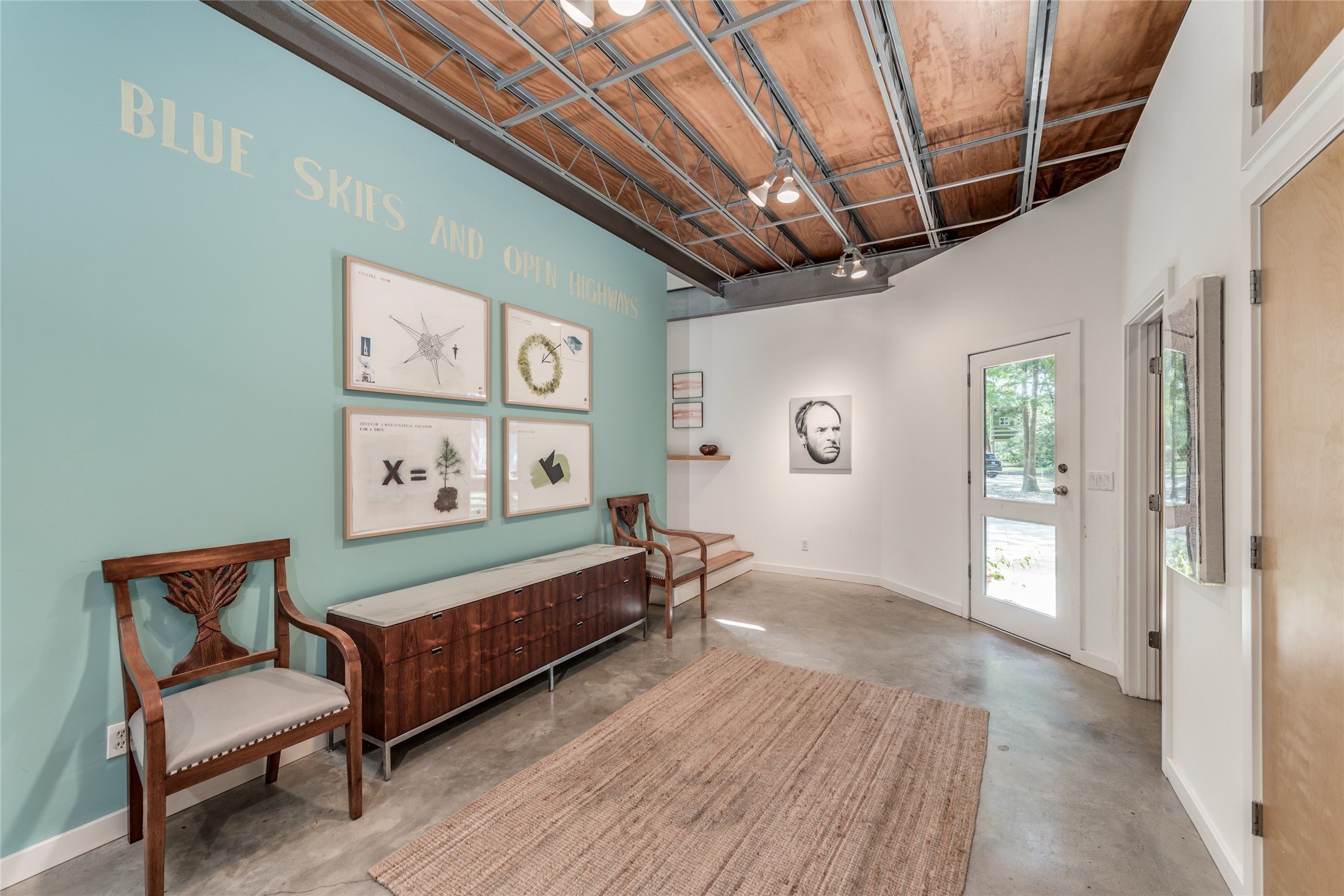5755 Knox Street Houston, TX 77091 - Photo 4 of 44 a spacious bedroom with a bed and a table