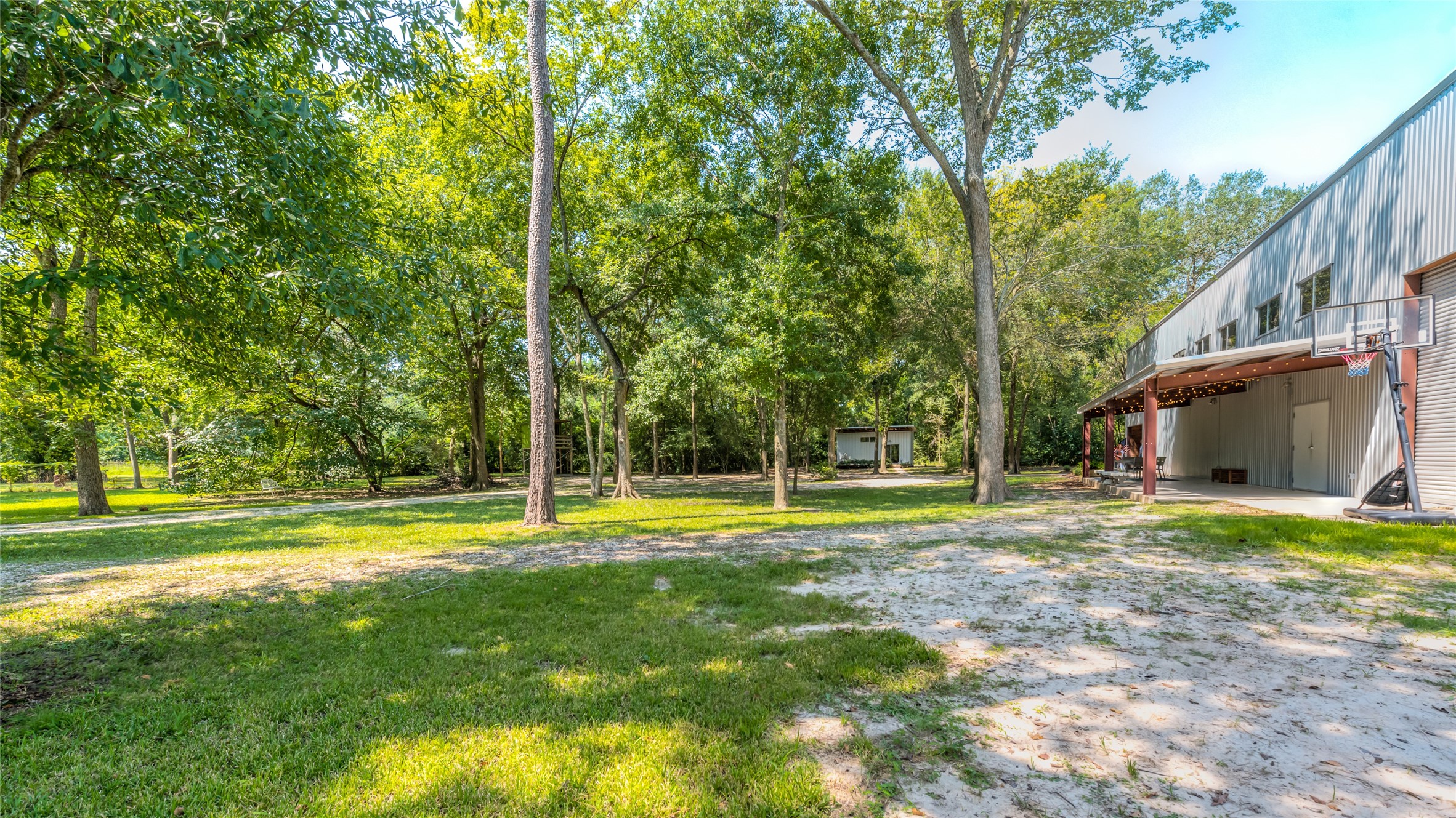 5755 Knox Street Houston, TX 77091 - Photo 44 of 44 a view of a house with a big yard and large trees