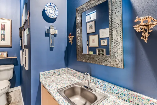 a kitchen with granite countertop cabinets stainless steel appliances a sink and a large window