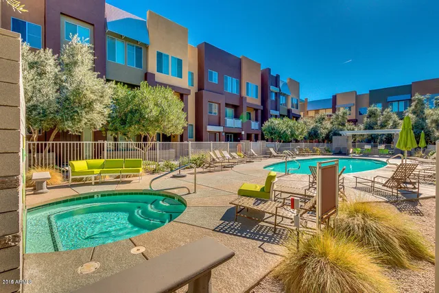 a view of a swimming pool with a lounge chairs