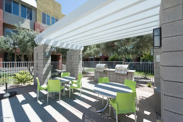 a view of a chairs and table in the patio