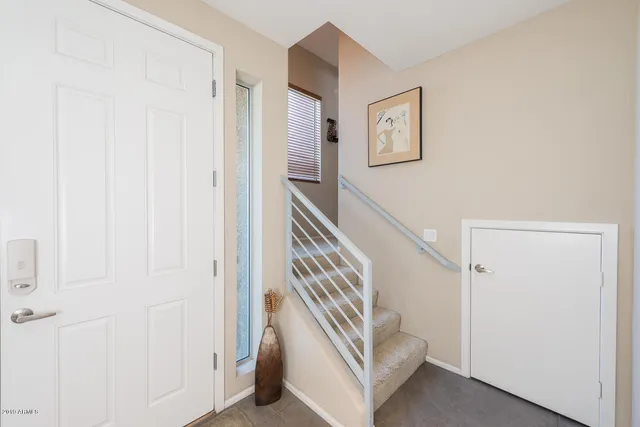a view of entryway with stairs and wooden floor