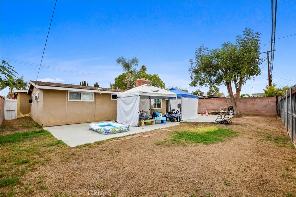 14049 Foster Road La Mirada, CA 90638 - Photo 15 of 16 a view of a house with backyard and sitting area