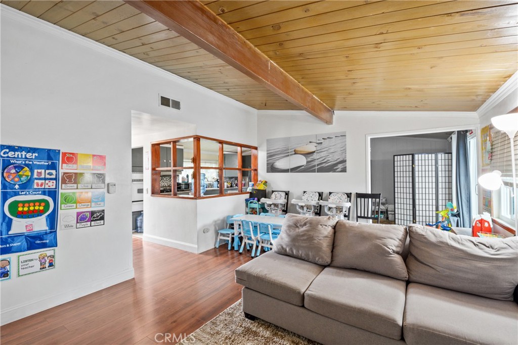 14049 Foster Road La Mirada, CA 90638 - Photo 3 of 16 a living room with furniture and a table