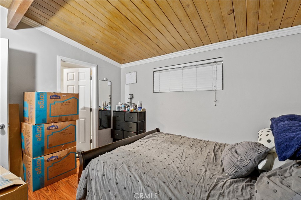 14049 Foster Road La Mirada, CA 90638 - Photo 9 of 16 a bedroom with a bed and a closet