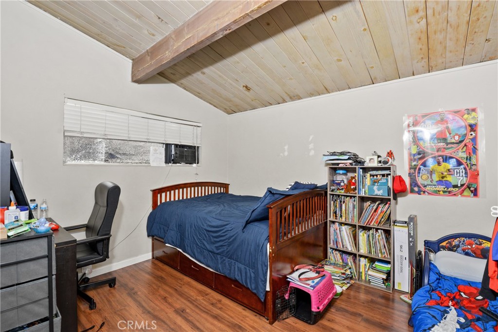 14049 Foster Road La Mirada, CA 90638 - Photo 10 of 16 a bedroom with furniture and a wooden floor