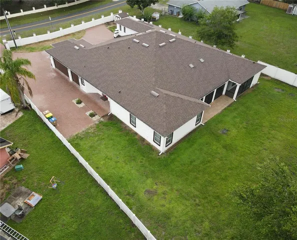 an empty room with windows and cabinet