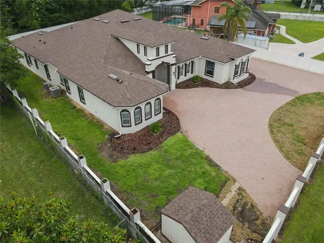a view of a hallway with chandelier and entryway