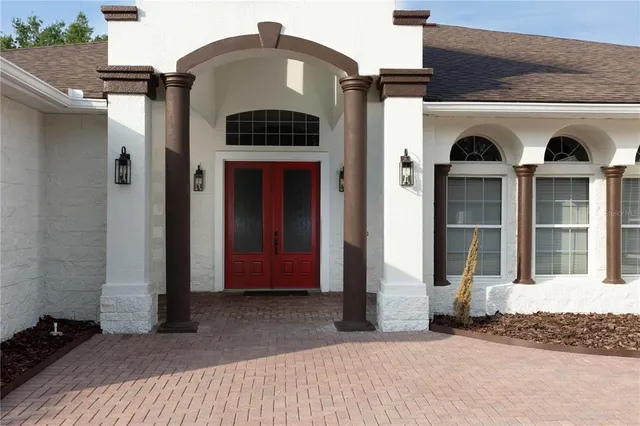 a kitchen with stainless steel appliances granite countertop a sink and a refrigerator