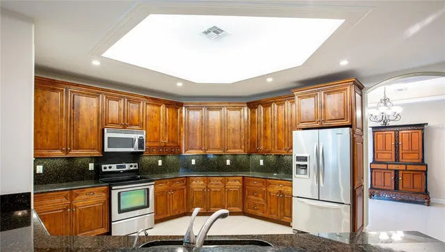a bedroom with furniture and a chandelier
