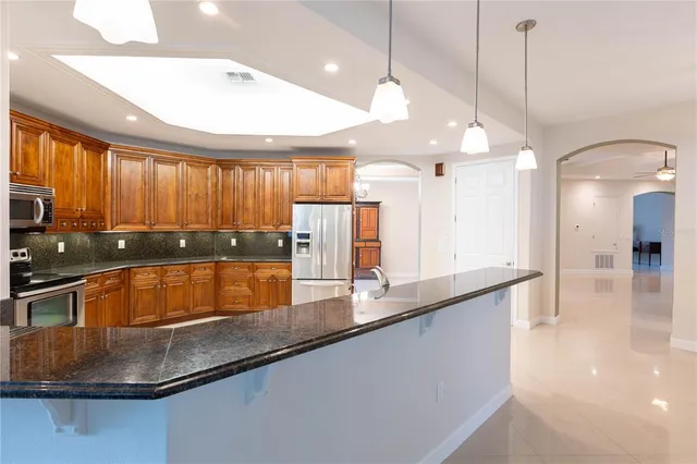 a bedroom with a bed furniture and a ceiling fan