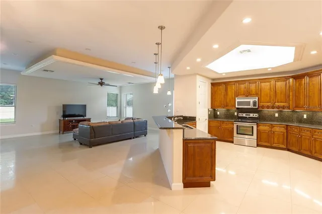 a view of walk in closet with clothes