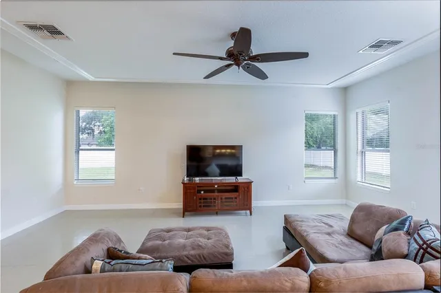 a spacious bathroom with a tub sink and mirror