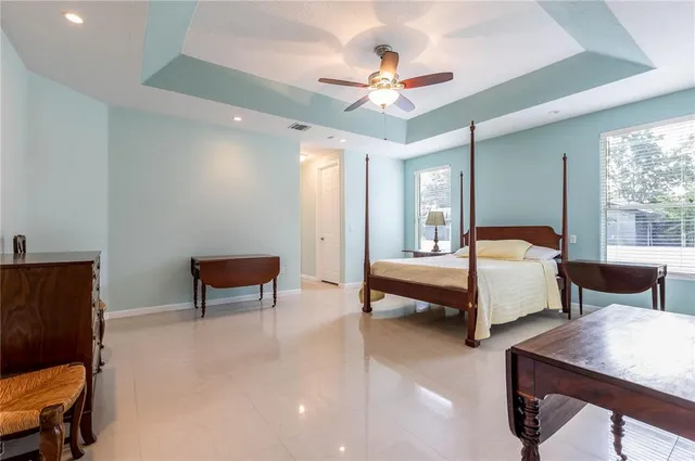 a spacious bathroom with sink shower and a bathtub