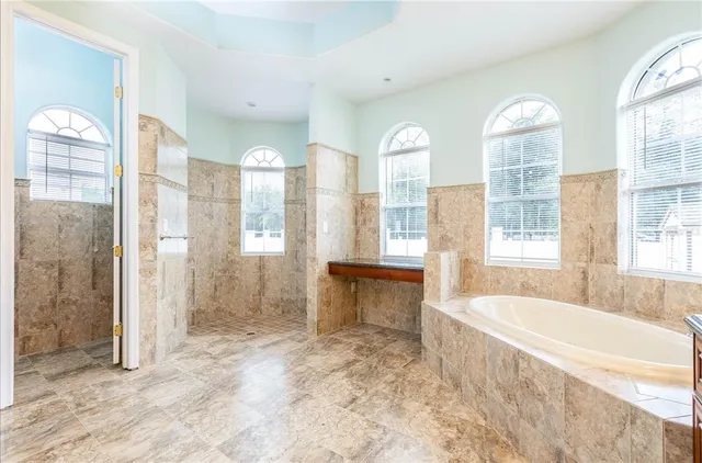 a bathroom with a sink a toilet and a bathtub