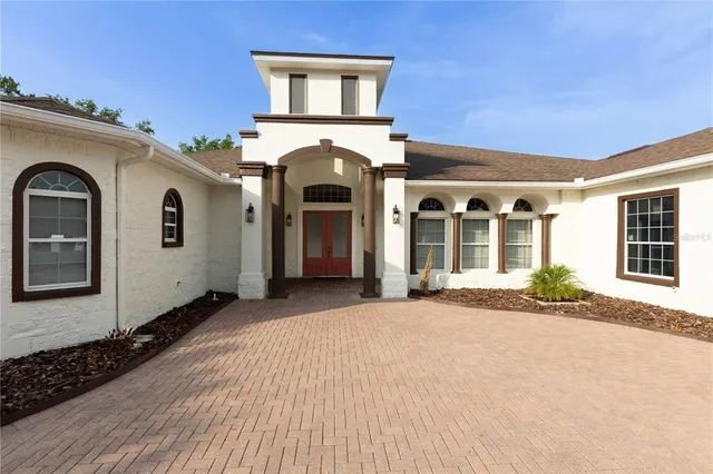 a front view of a house with parking