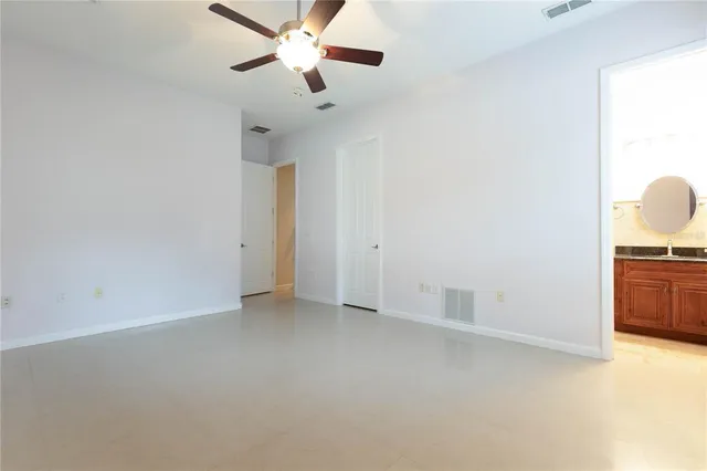 a bathroom with a toilet a sink and shower