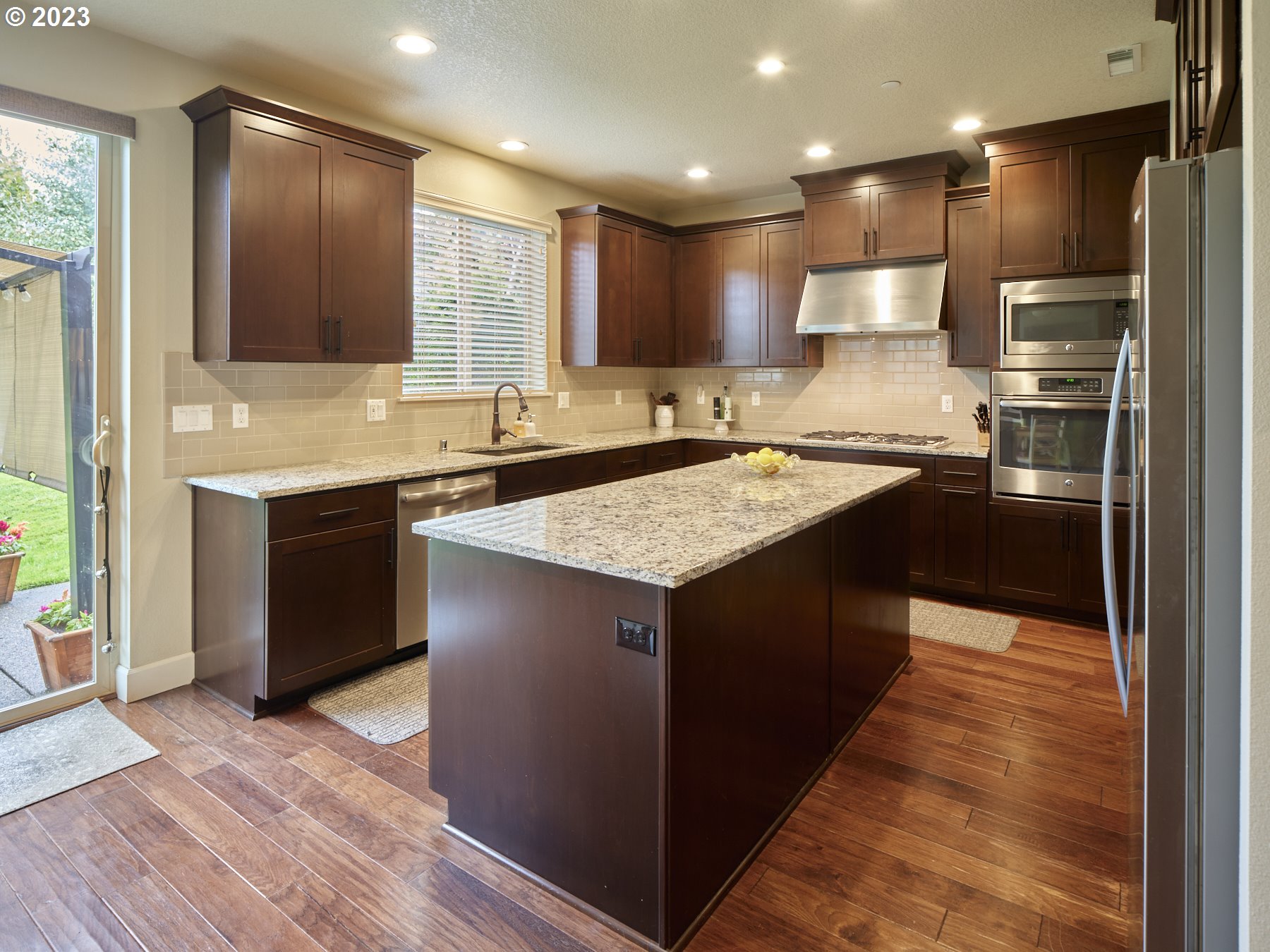 1424 Northwest Goodwin Street Camas, WA 98607 - Photo 11 of 40 a kitchen with a sink stove and refrigerator
