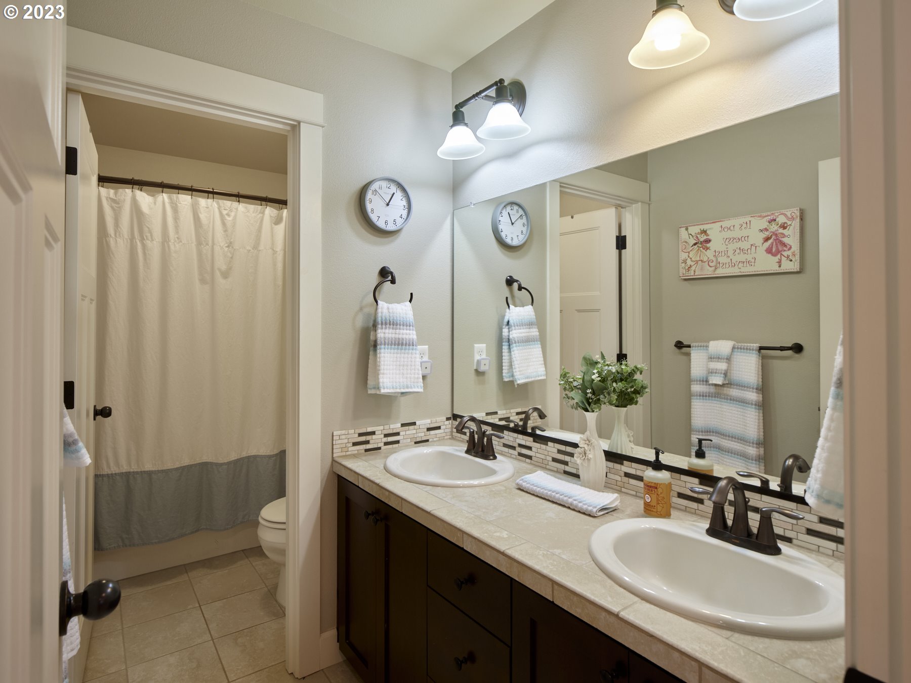 1424 Northwest Goodwin Street Camas, WA 98607 - Photo 28 of 40 a bathroom with 2 sink and a mirror