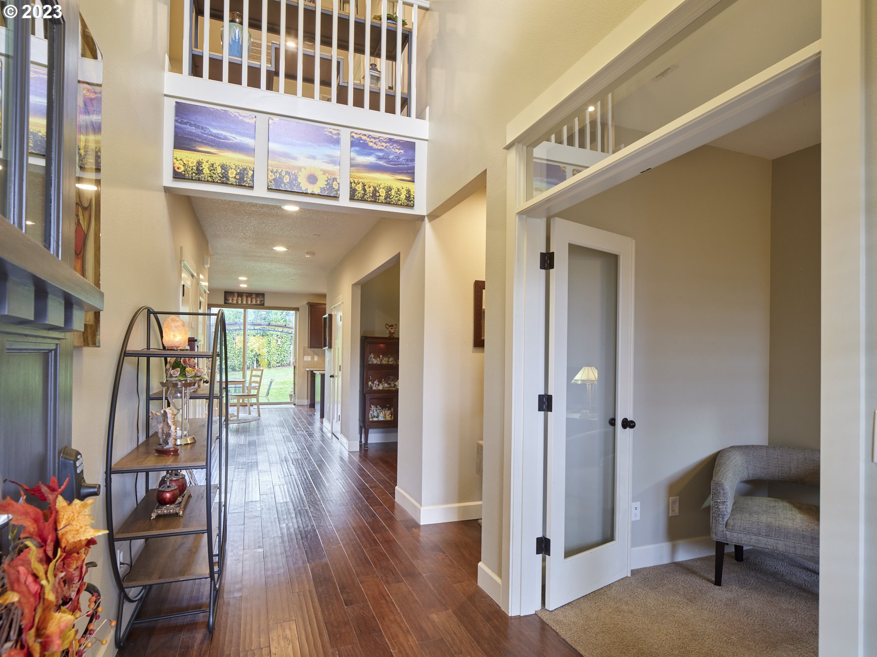 1424 Northwest Goodwin Street Camas, WA 98607 - Photo 4 of 40 a view of a hallway with wooden floor and windows