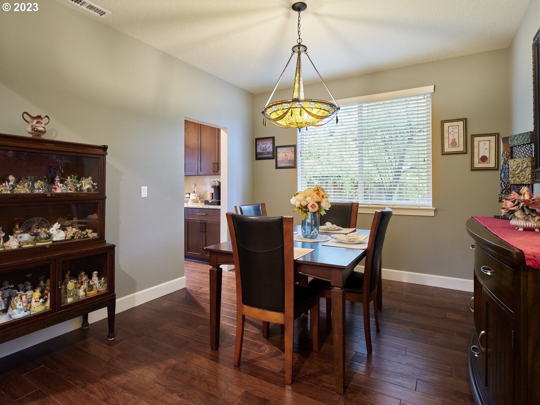 1424 Northwest Goodwin Street Camas, WA 98607 - Photo 8 of 40 a dining room with furniture a chandelier and wooden floor