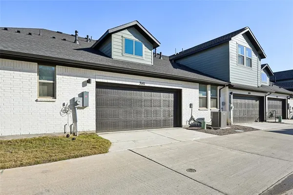 a kitchen with a sink a stove and cabinets