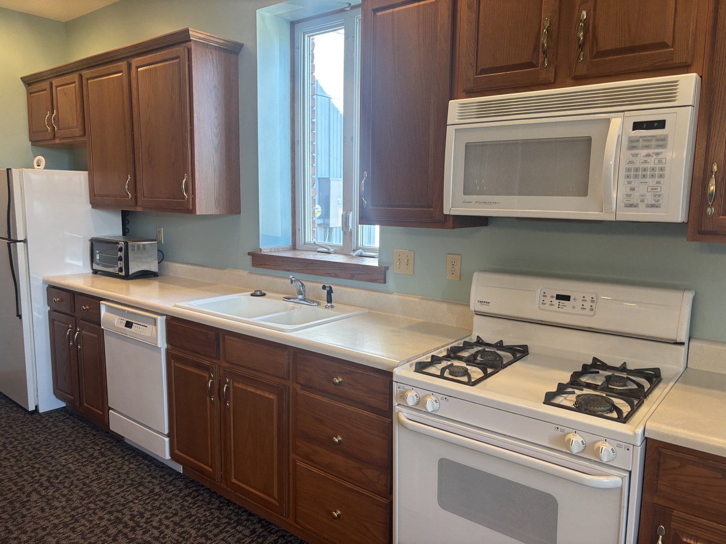 320 North Main Street Roanoke, IL 61561 - Photo 13 of 23 a kitchen with a cabinets stove and sink