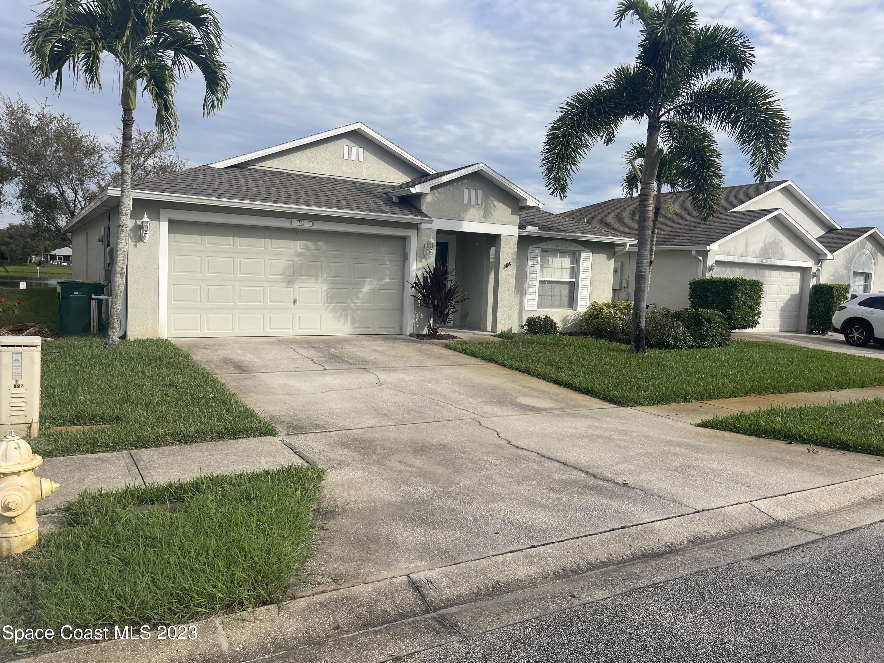 front view of a house and a yard