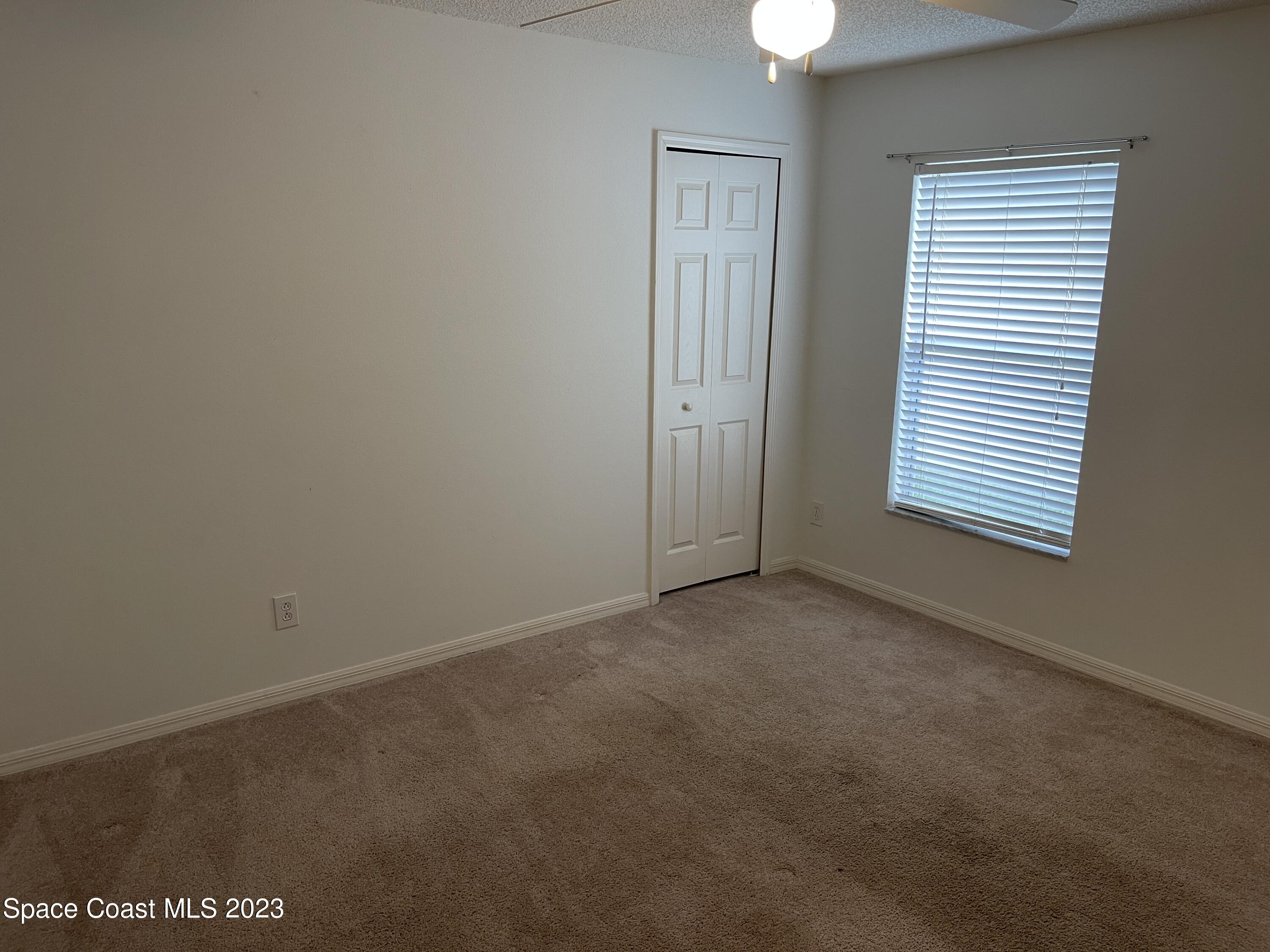 527 Melanie Circle Melbourne, FL 32901 - Photo 14 of 18 an empty room with a window