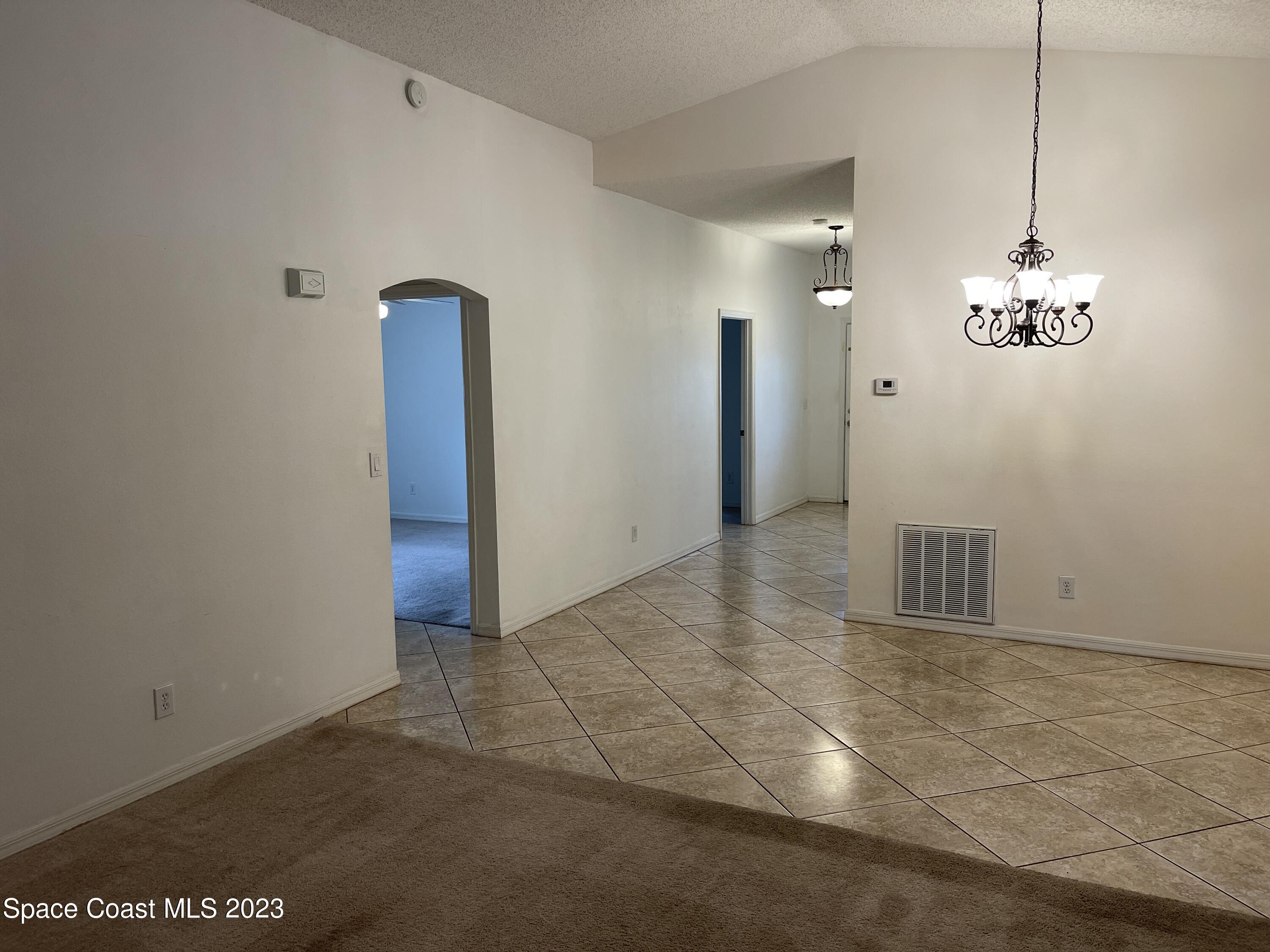 527 Melanie Circle Melbourne, FL 32901 - Photo 4 of 18 a view of an empty room