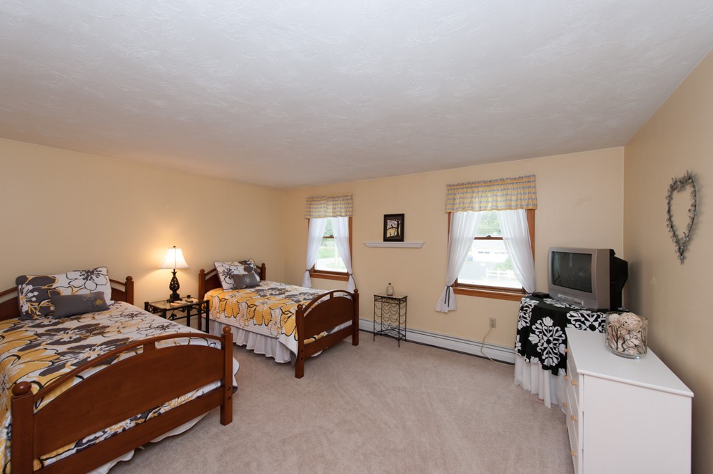 132 Howland Road Lakeville, MA 02347 - Photo 29 of 30 a bedroom with two beds and a window