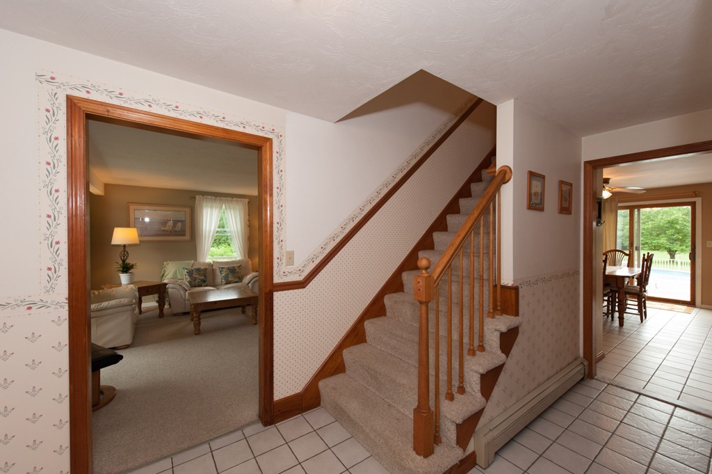 132 Howland Road Lakeville, MA 02347 - Photo 8 of 30 a view of a livingroom with furniture and stairs