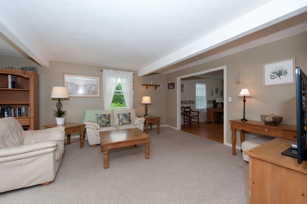 132 Howland Road Lakeville, MA 02347 - Photo 10 of 30 a living room with furniture and a wooden floor