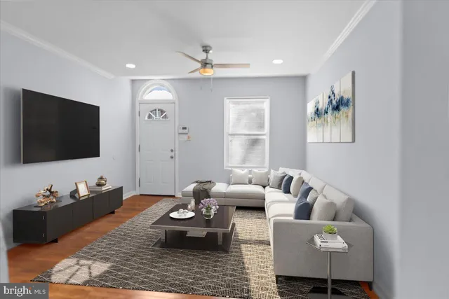 a kitchen with stainless steel appliances granite countertop a refrigerator stove and white cabinets