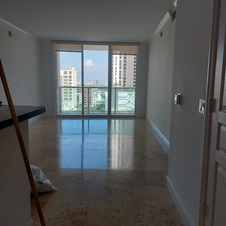 350 Southeast 2nd Street, Unit 1260 Fort Lauderdale, FL 33301 - Photo 2 of 6 a view of an empty room with glass door