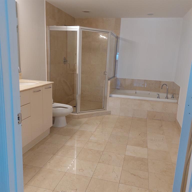 350 Southeast 2nd Street, Unit 1260 Fort Lauderdale, FL 33301 - Photo 3 of 6 a bathroom with a toilet and a shower