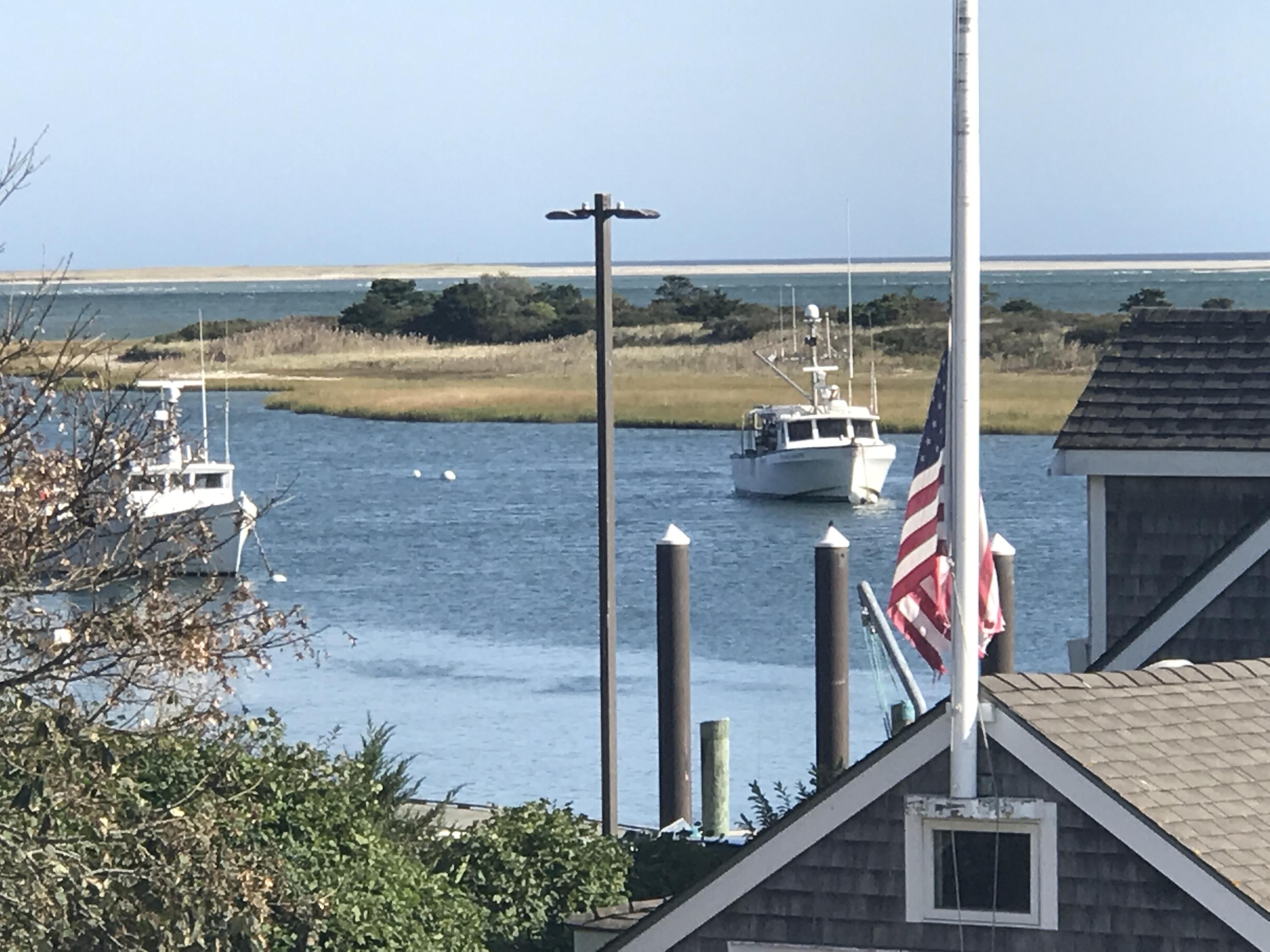 60 Youngs Road Chatham, MA 02633 - Photo 1 of 21 a view of ocean from a balcony