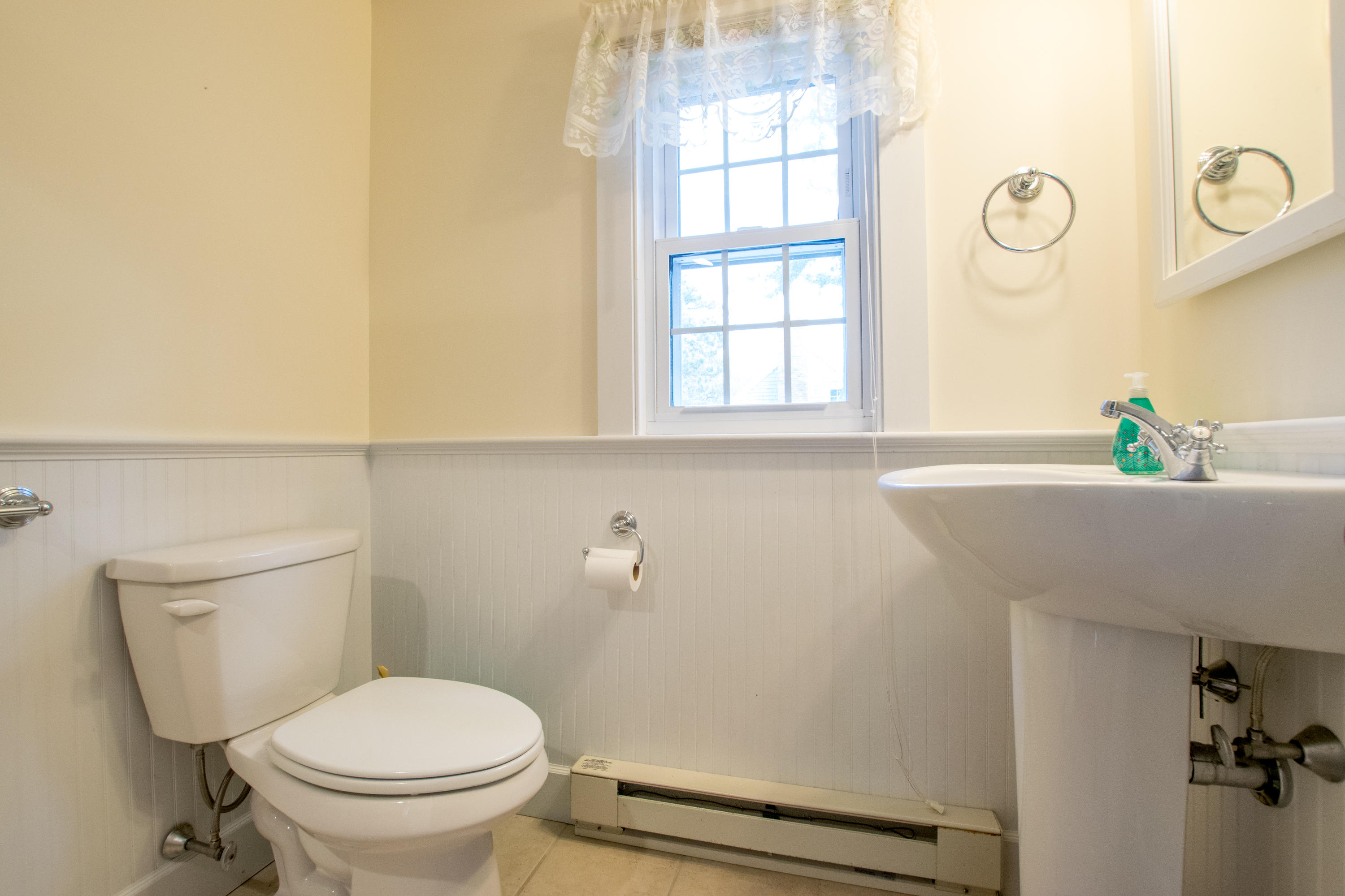 60 Youngs Road Chatham, MA 02633 - Photo 12 of 21 a bathroom with a toilet a sink and a window