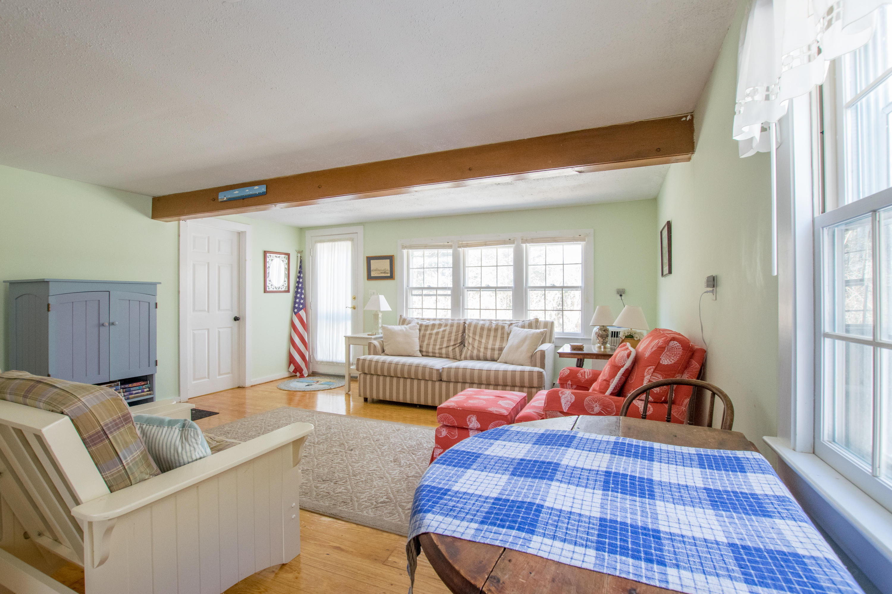 60 Youngs Road Chatham, MA 02633 - Photo 4 of 21 a living room with furniture and a rug