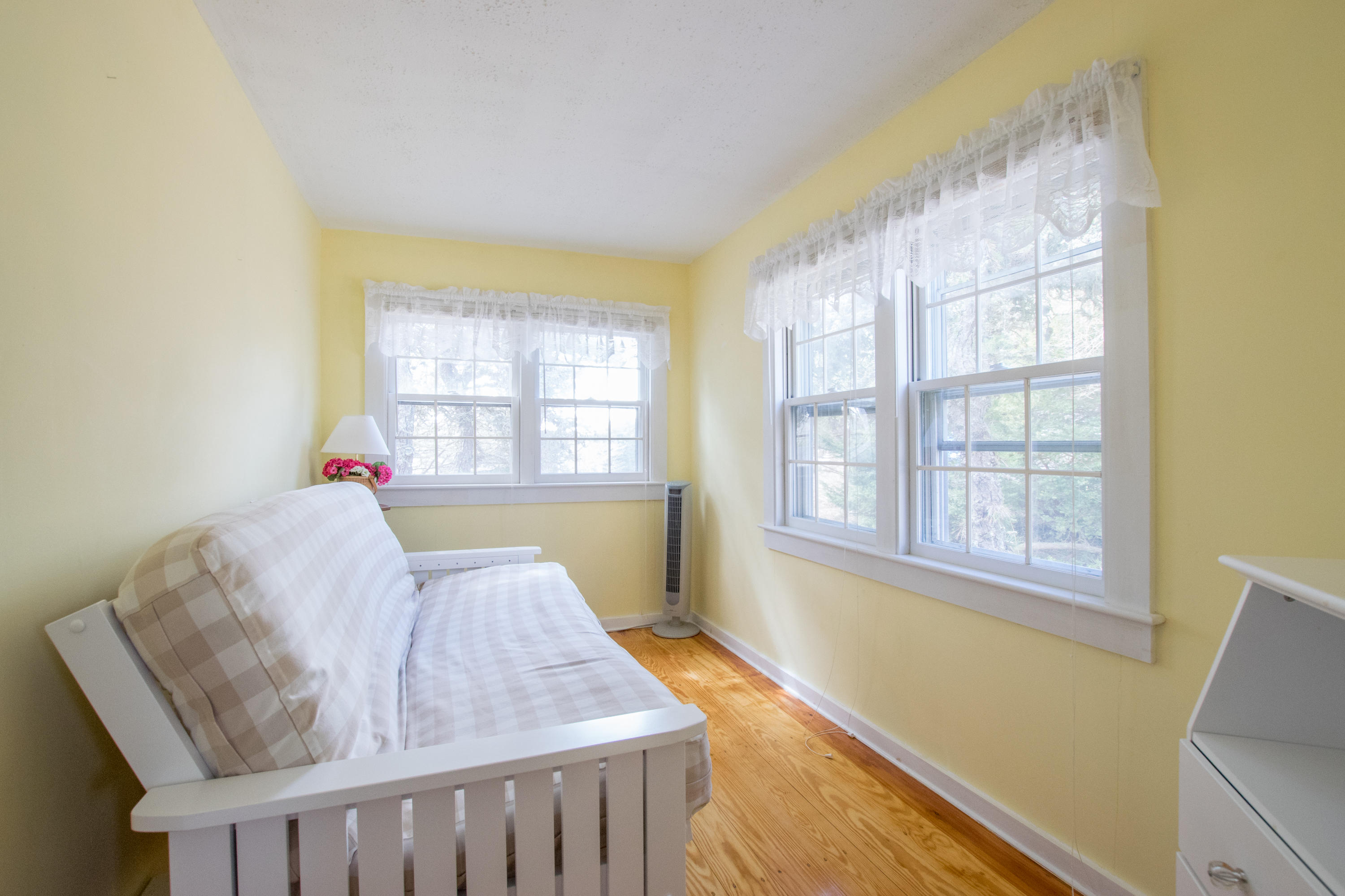 60 Youngs Road Chatham, MA 02633 - Photo 7 of 21 a bed sitting in a bedroom next to a window