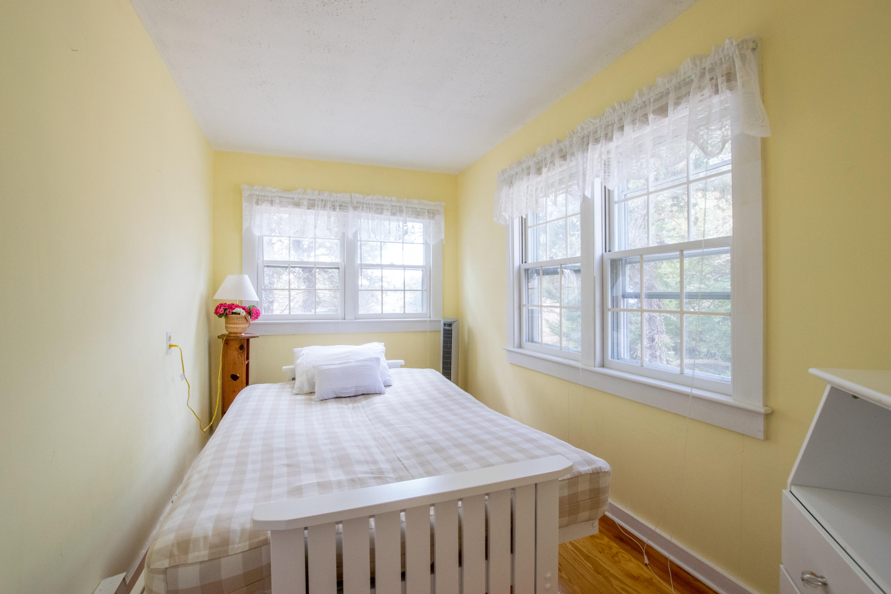60 Youngs Road Chatham, MA 02633 - Photo 8 of 21 a bedroom with a bed and a window