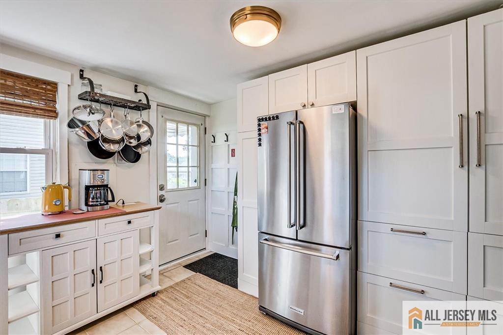 121 East Cliff Road Colonia, NJ 07067 - Photo 18 of 35 a kitchen with stainless steel appliances a refrigerator sink and cabinets